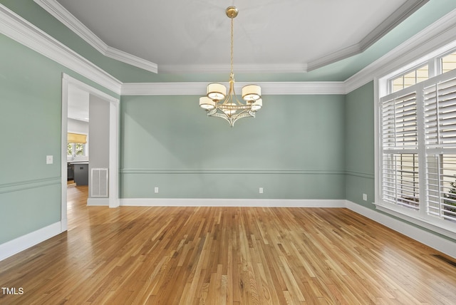 7112 Hasentree Way, Wake Forest, NC 27587 - empty room featuring a chandelier, crown molding, and hardwood / wood-style flooring