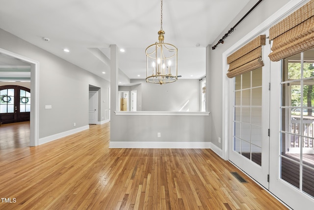 7112 Hasentree Way, Wake Forest, NC 27587 - unfurnished dining area with a chandelier, light wood-style flooring, french doors, and recessed lighting