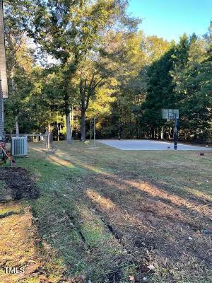 3553 Northway Dr, Zebulon, NC 27597 - view of yard with basketball hoop