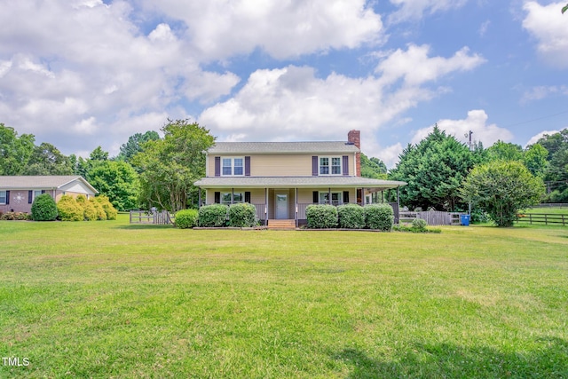 3542 Anderson Valley Rd, Mcleansville, NC 27301 - view of front facade with a chimney and covered porch