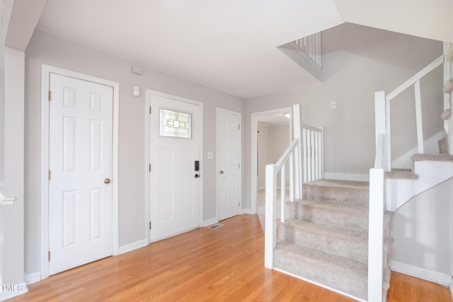 3542 Anderson Valley Rd, Mcleansville, NC 27301 - foyer with stairway and light wood-style flooring