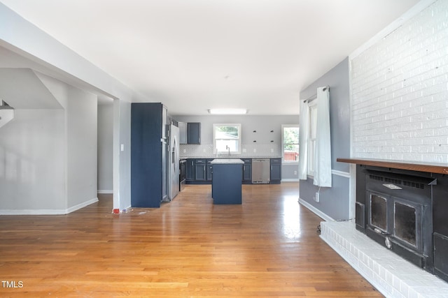 3542 Anderson Valley Rd, Mcleansville, NC 27301 - unfurnished living room featuring a sink and light wood-style floors