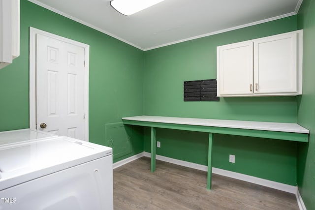 3542 Anderson Valley Rd, Mcleansville, NC 27301 - laundry room featuring cabinet space, crown molding, and wood finished floors