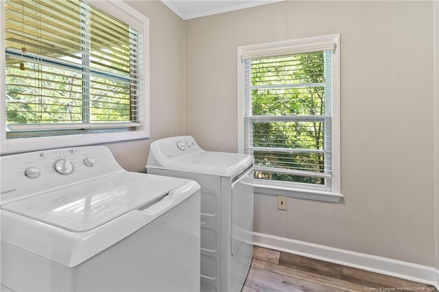 3810 David St, Fayetteville, NC 28304 - laundry area with washer and dryer, wood finished floors, crown molding, and a decorative wall