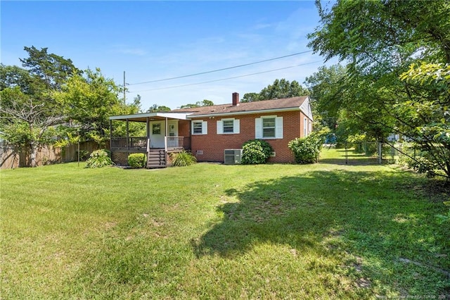 3810 David St, Fayetteville, NC 28304 - view of front of house with a porch, brick siding, a fenced backyard, and a chimney