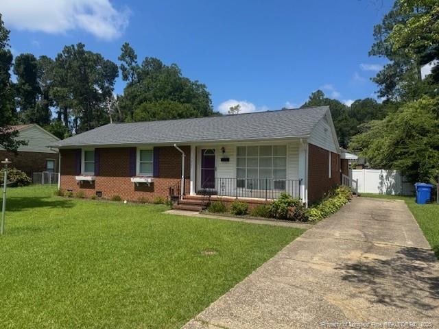 5027 Chesapeake Rd, Fayetteville, NC 28311 - ranch-style house featuring covered porch, concrete driveway, and brick siding