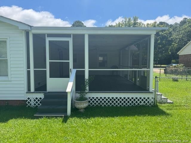 5027 Chesapeake Rd, Fayetteville, NC 28311 - back of property with a sunroom
