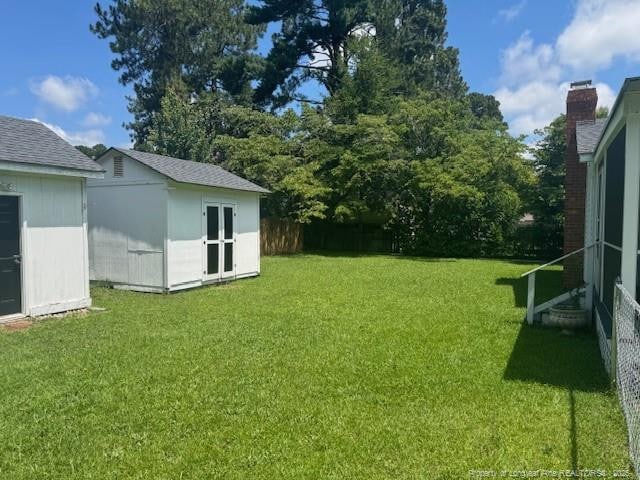 5027 Chesapeake Rd, Fayetteville, NC 28311 - view of green lawn featuring a storage shed
