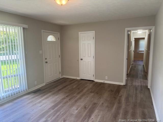 5027 Chesapeake Rd, Fayetteville, NC 28311 - entrance foyer featuring plenty of natural light and dark wood finished floors