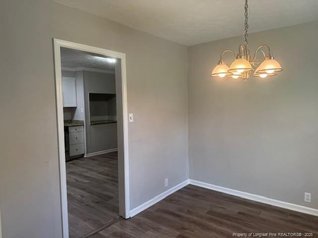 5027 Chesapeake Rd, Fayetteville, NC 28311 - unfurnished dining area featuring a chandelier and dark wood-style flooring