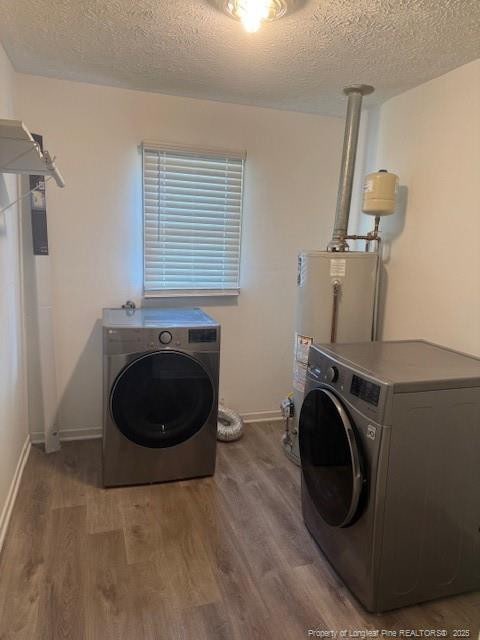 5027 Chesapeake Rd, Fayetteville, NC 28311 - washroom with washer / dryer, a textured ceiling, and wood finished floors