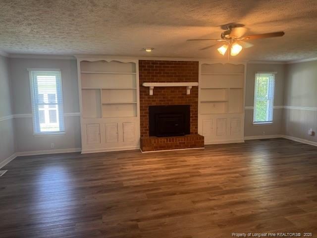 5027 Chesapeake Rd, Fayetteville, NC 28311 - unfurnished living room with a textured ceiling, a ceiling fan, healthy amount of natural light, crown molding, and built in shelves