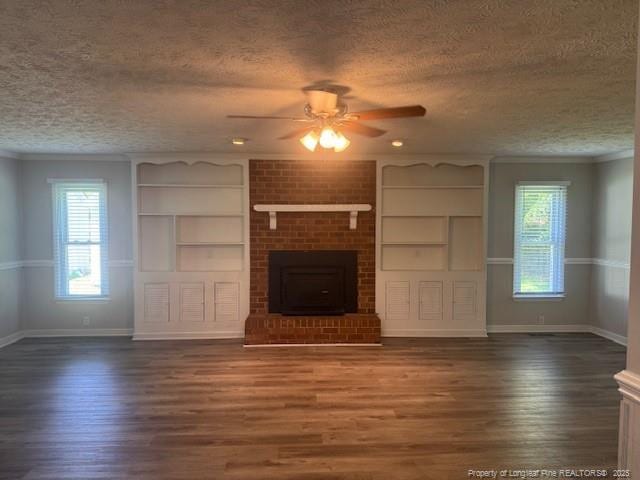 5027 Chesapeake Rd, Fayetteville, NC 28311 - unfurnished living room with a textured ceiling, ceiling fan, wood finished floors, built in features, and crown molding