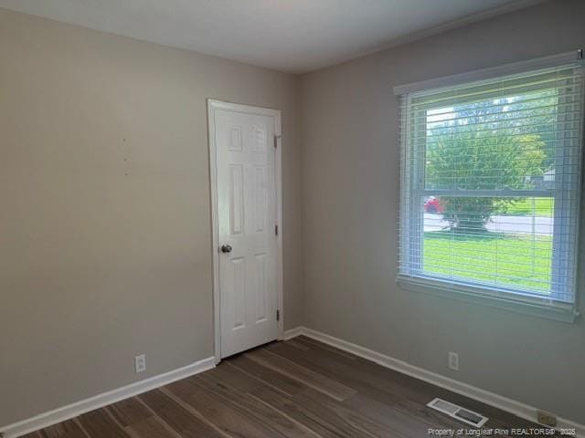 5027 Chesapeake Rd, Fayetteville, NC 28311 - unfurnished room with dark wood-type flooring and baseboards