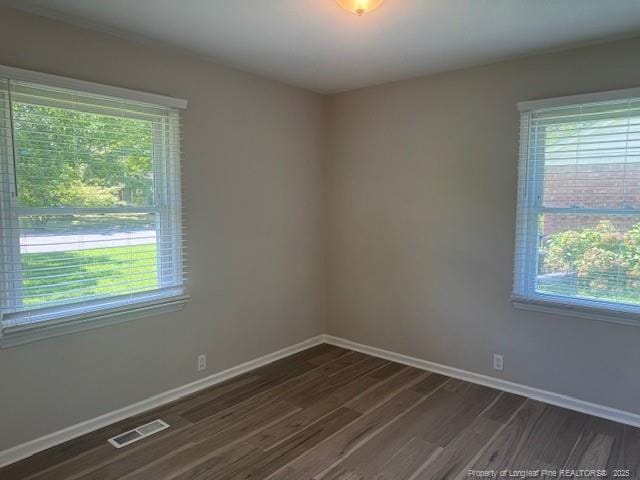 5027 Chesapeake Rd, Fayetteville, NC 28311 - spare room with plenty of natural light and dark wood-style flooring