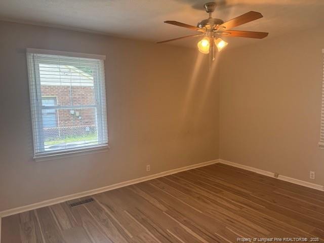 5027 Chesapeake Rd, Fayetteville, NC 28311 - spare room with dark wood finished floors and ceiling fan