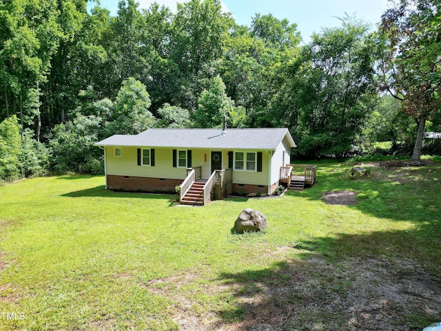 8905 Dukes Lake Rd, Zebulon, NC 27597 - view of front of house with crawl space, a front lawn, and a shingled roof