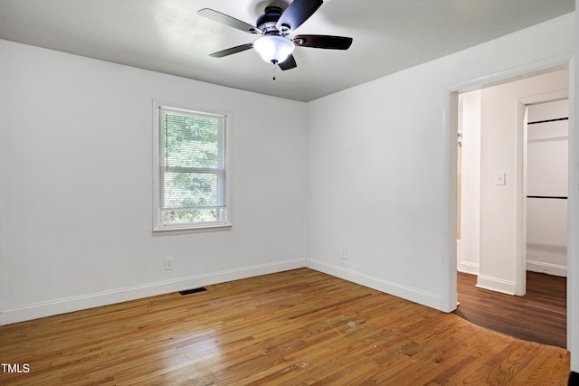 8905 Dukes Lake Rd, Zebulon, NC 27597 - empty room featuring a ceiling fan and light wood finished floors