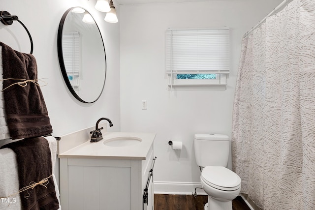 8905 Dukes Lake Rd, Zebulon, NC 27597 - bathroom with vanity and wood finished floors