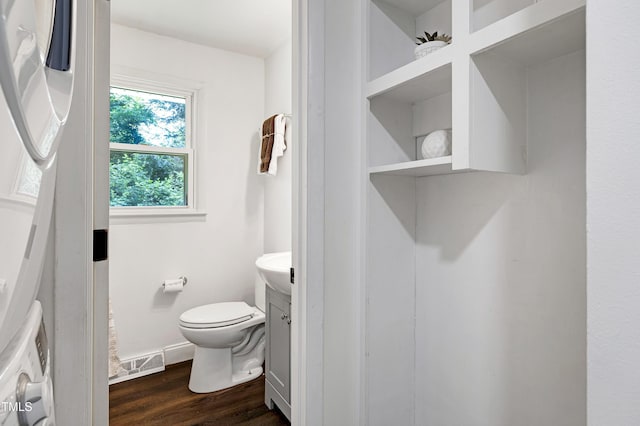 8905 Dukes Lake Rd, Zebulon, NC 27597 - half bath featuring vanity and wood finished floors