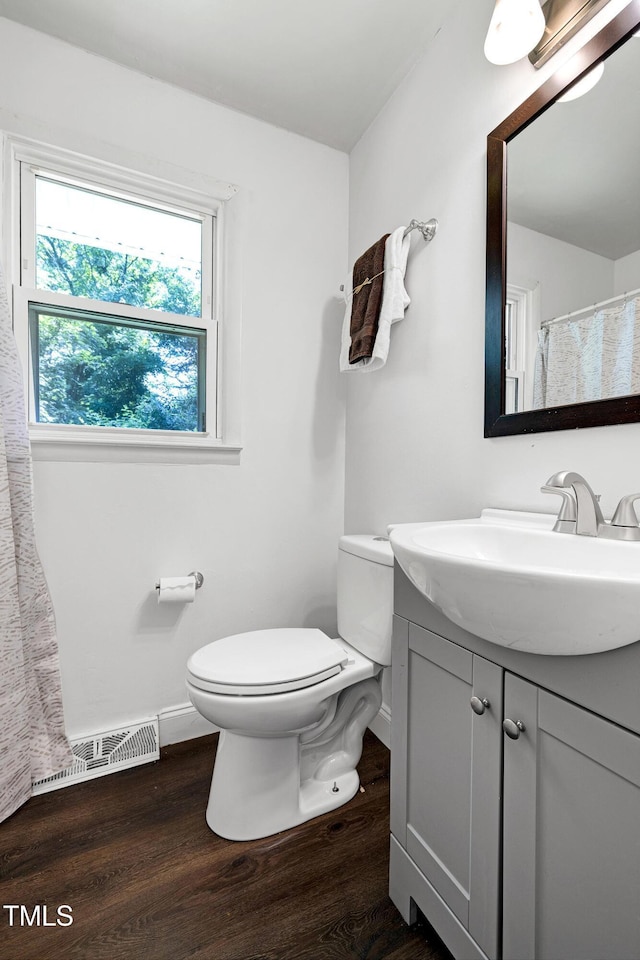 8905 Dukes Lake Rd, Zebulon, NC 27597 - bathroom with wood finished floors and vanity