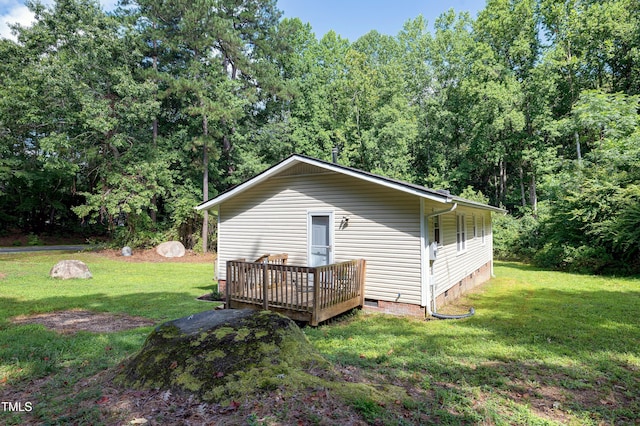 8905 Dukes Lake Rd, Zebulon, NC 27597 - back of property with crawl space, a wooden deck, and a yard