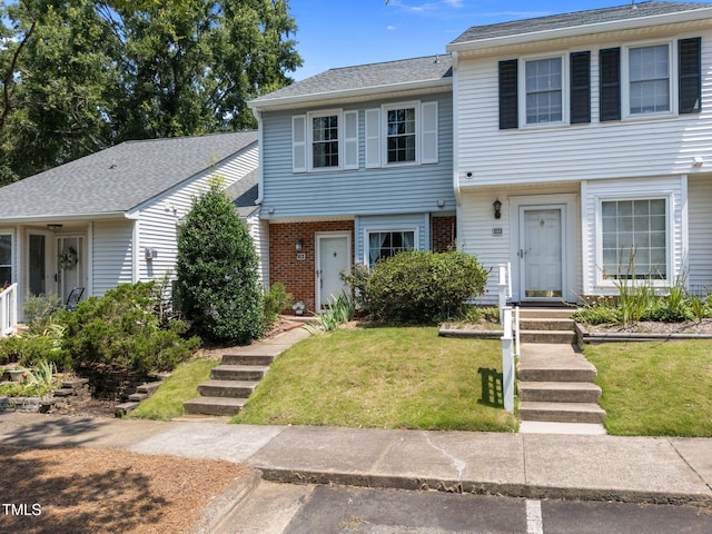 116 Saint Andrews Ln, Chapel Hill, NC 27517 - colonial home with brick siding, a front yard, and a shingled roof