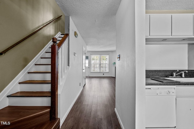 116 Saint Andrews Ln, Chapel Hill, NC 27517 - stairway with a textured ceiling and wood finished floors