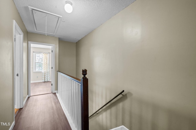 116 Saint Andrews Ln, Chapel Hill, NC 27517 - corridor with an upstairs landing, attic access, wood finished floors, and a textured ceiling