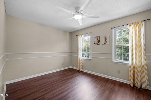116 Saint Andrews Ln, Chapel Hill, NC 27517 - empty room featuring dark wood finished floors, a textured ceiling, and a ceiling fan