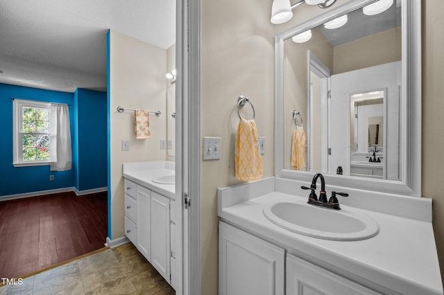 116 Saint Andrews Ln, Chapel Hill, NC 27517 - bathroom with two vanities and baseboards