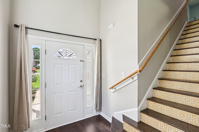 1212 Southgate Dr, Raleigh, NC 27610 - entrance foyer with dark wood-style floors, stairs, and a towering ceiling
