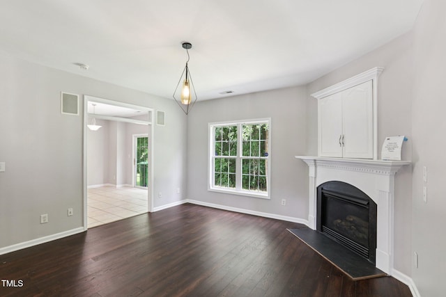 1212 Southgate Dr, Raleigh, NC 27610 - unfurnished living room with dark wood finished floors and a glass covered fireplace