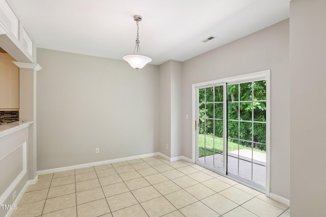1212 Southgate Dr, Raleigh, NC 27610 - unfurnished dining area with light tile patterned flooring and baseboards