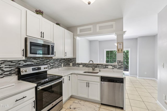 1212 Southgate Dr, Raleigh, NC 27610 - kitchen featuring stainless steel appliances, decorative backsplash, white cabinetry, and light stone counters