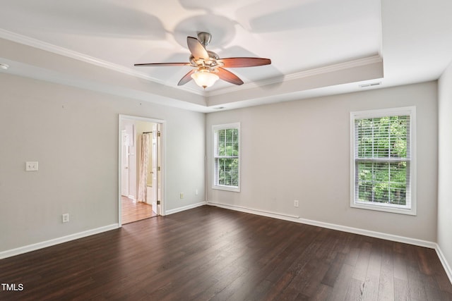 1212 Southgate Dr, Raleigh, NC 27610 - empty room with a raised ceiling, crown molding, ceiling fan, and dark wood-style flooring