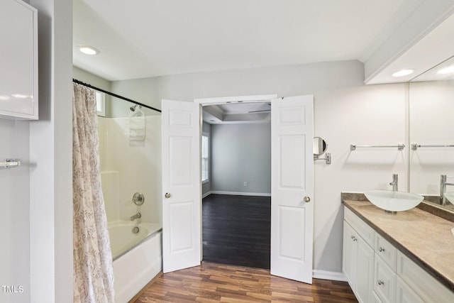 1212 Southgate Dr, Raleigh, NC 27610 - full bath featuring vanity, wood finished floors, shower / tub combo with curtain, and recessed lighting