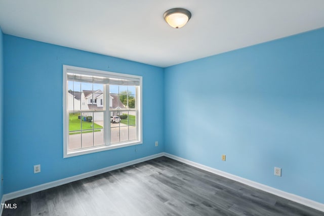 1212 Southgate Dr, Raleigh, NC 27610 - empty room featuring dark wood-type flooring and baseboards