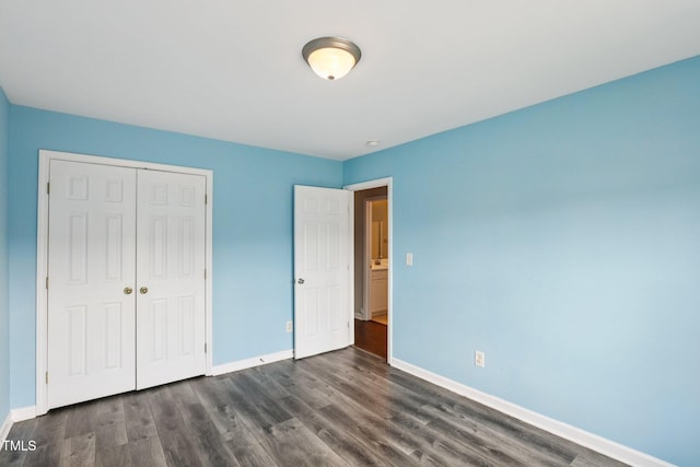1212 Southgate Dr, Raleigh, NC 27610 - unfurnished bedroom with a closet and dark wood-type flooring