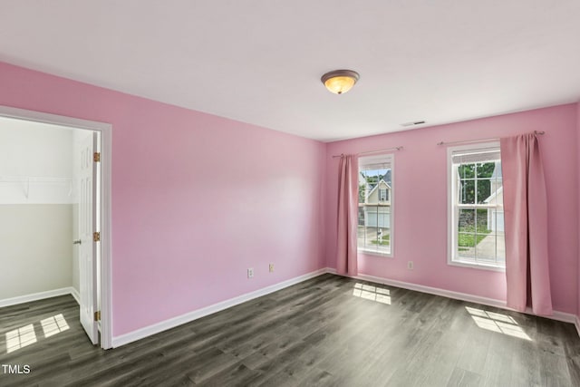 1212 Southgate Dr, Raleigh, NC 27610 - spare room featuring dark wood finished floors and baseboards