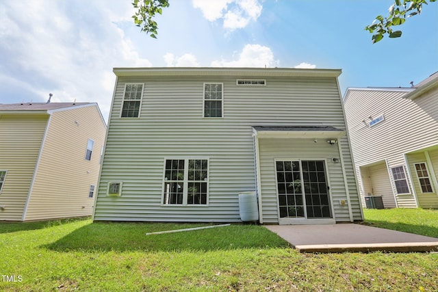 1212 Southgate Dr, Raleigh, NC 27610 - rear view of house featuring a lawn and a patio