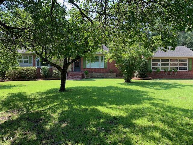 1003 Summerville Mamers Rd, Lillington, NC 27546 - view of front of home with brick siding and a front lawn