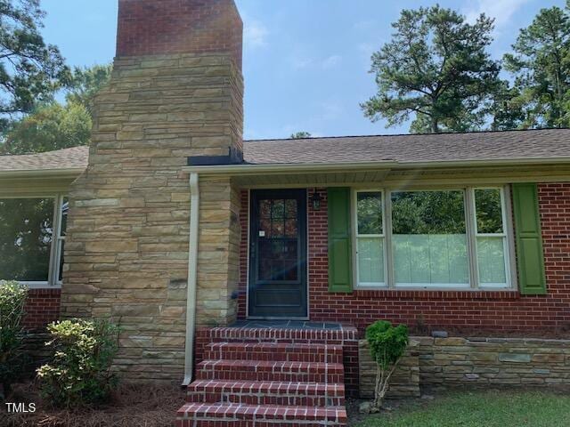 1003 Summerville Mamers Rd, Lillington, NC 27546 - doorway to property featuring a chimney and a shingled roof