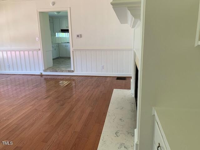 1003 Summerville Mamers Rd, Lillington, NC 27546 - spare room with wood finished floors and wainscoting