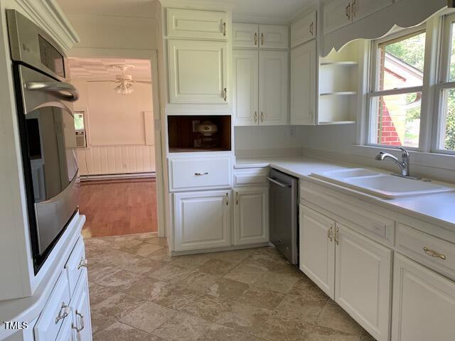 1003 Summerville Mamers Rd, Lillington, NC 27546 - kitchen featuring stainless steel appliances, open shelves, white cabinetry, and light countertops