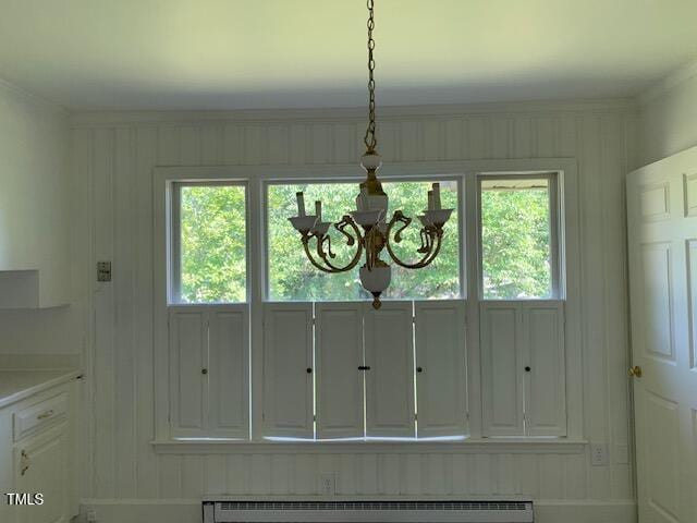1003 Summerville Mamers Rd, Lillington, NC 27546 - detailed view of a chandelier, crown molding, and baseboard heating