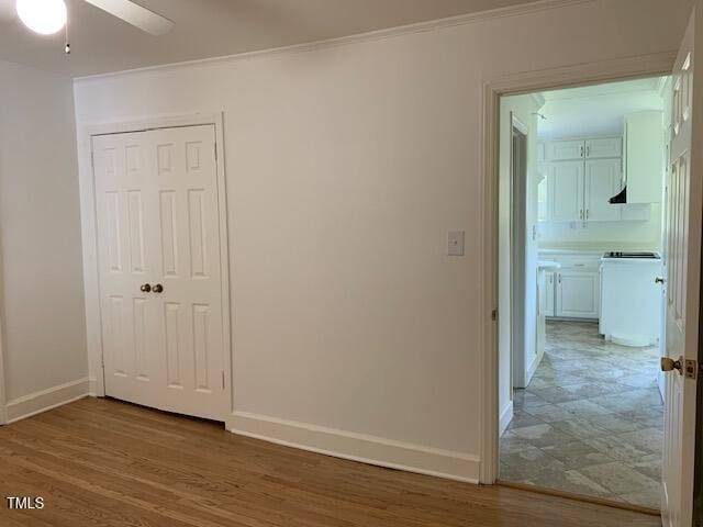1003 Summerville Mamers Rd, Lillington, NC 27546 - spare room featuring light wood-style floors, ornamental molding, and ceiling fan