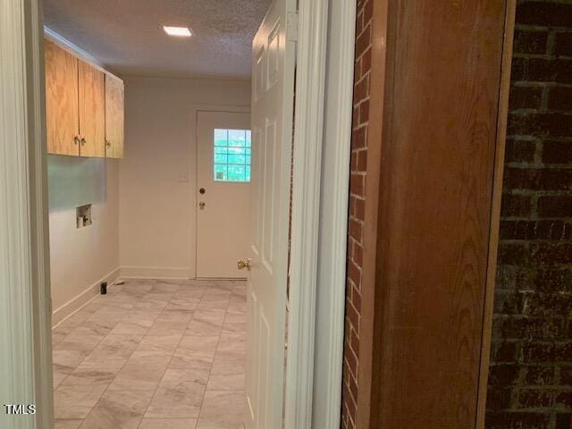 1003 Summerville Mamers Rd, Lillington, NC 27546 - laundry room with washer hookup, cabinet space, and a textured ceiling