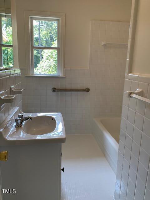 1003 Summerville Mamers Rd, Lillington, NC 27546 - full bath featuring tile walls, vanity, and a wainscoted wall