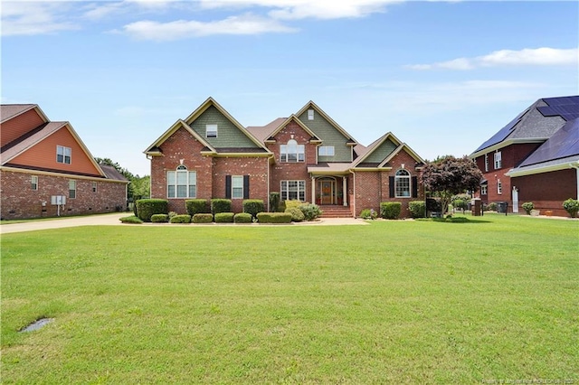 2825 Sand Trap Ln, Hope Mills, NC 28348 - craftsman house featuring a front yard and brick siding